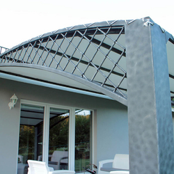 A wrought iron awning in a family house patio