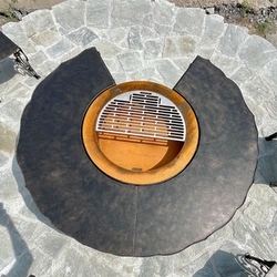 Multifunctional fire pit with grill and wood storage space Multifunctional fire pit with grill and wood storage space