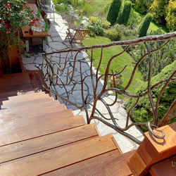 Design railing for stairs in the exterior of a family cottage  exceptional wrought-iron railings in high quality