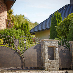 A hand forged fence and gate with sheet metal - A luxury fence and gate