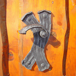 A wrought iron handle - bark A wrought iron handle - bark