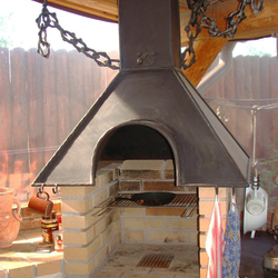 A wrought iron fireplace set A wrought iron fireplace set