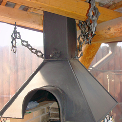 A wrought iron fireplace set A wrought iron fireplace set