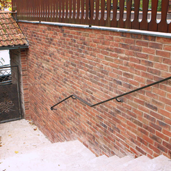 A wrought iron gate and railing A wrought iron gate and railing