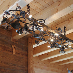 A wrought iron chandelier - a vine leaf A wrought iron chandelier - a vine leaf
