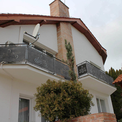 A modern wrought iron railing with a chain - exterior railings A modern wrought iron railing with a chain - exterior railings