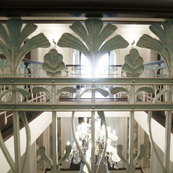 Detail of ironwork on indoor railing