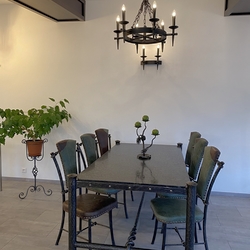 Historic interior design  Lightings, aluxury table and chairs, and acandle holder