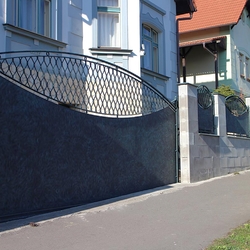 A wrought iron fence - metal and wrought iron combination