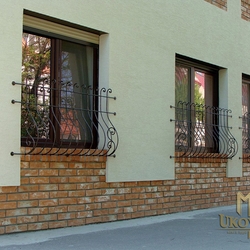 A wrought iron grille with a belly