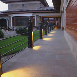 A wrought iron railing with built-in lights