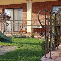 A wrought iron terrace railing