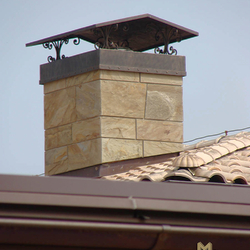 A wrought-iron chimney roof