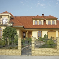 Forged gates, fence and balcony railing at afamily home