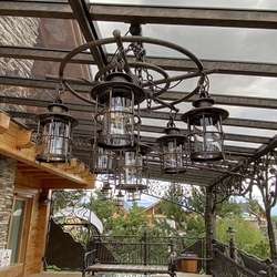 Hand forged chandelier for a cottage patio – an original outdoor lighting Hand forged chandelier for a cottage patio – an original outdoor lighting