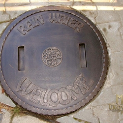 A wrought iron shaft cover